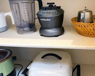 Assorted appliances: Nutribullet, Sunbeam electric skillet