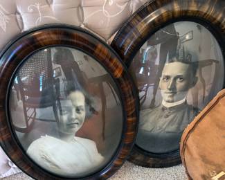 Antique oval-framed portraits