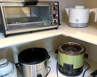 Assorted appliances: GE toaster oven, Rival Hot Pot Express, Crockpots