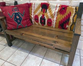 Wooden bench, red crystal patterned throw pillow