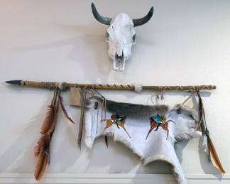 Arrow with hide, cow skull