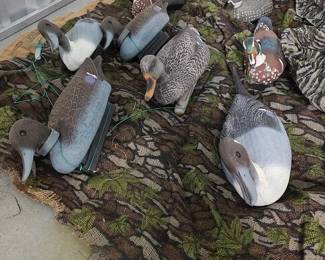 Collection of 8 ducks, two camo sheets and a storage bag