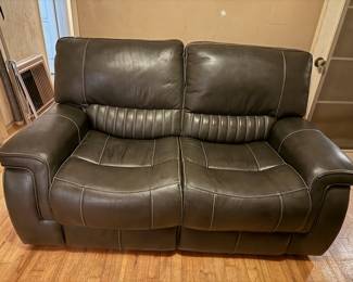 Reclining leather loveseat