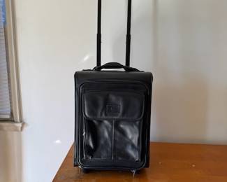 Lancel leather carryon suitcase.