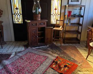 Beautiful Spanish colonial cabinet with a over 3 foot Mexican candle holder set of Mexican vases or candleholders lots of antique rugs