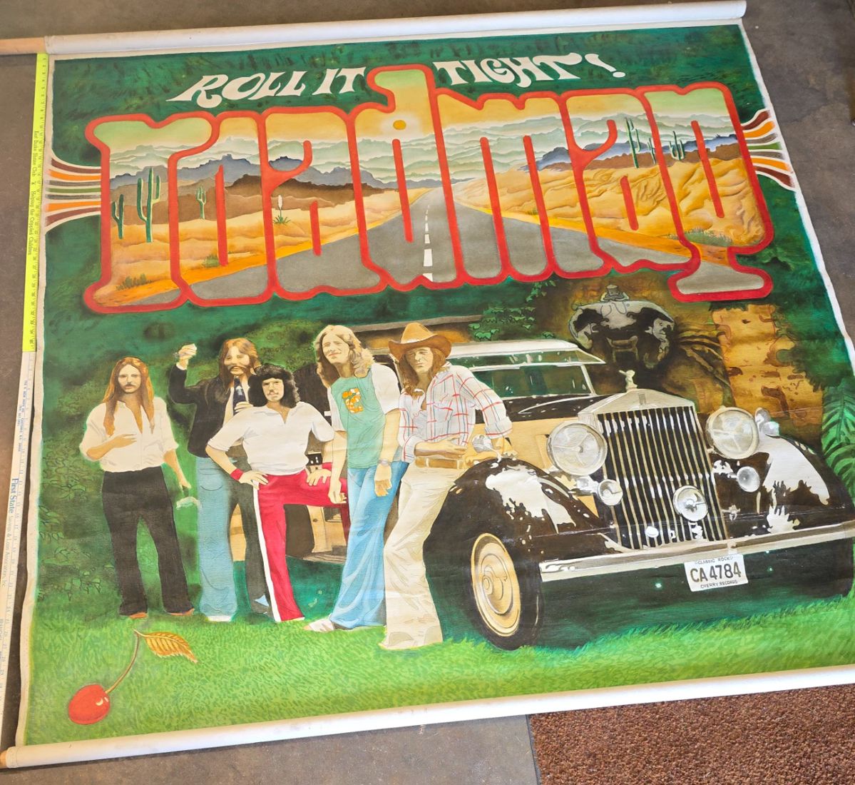 6 ' canvas painted to match the cover of their 1978 album 
ROLL IT TIGHT
They used it as a backdrop when they did gigs.
Small reserve. 