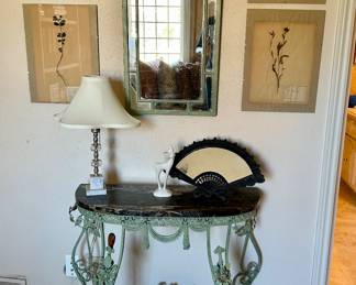 Gorgeous 1920’s art deco wrought iron, marble top table with matching mirror. Early 1900’s framed flower specimens 
