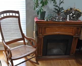 Cane Bottom Rocker/ Electric Fireplace