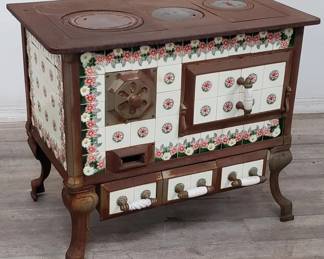 Lot # : 145 - Antique cast iron and tiled wood-burning stove
