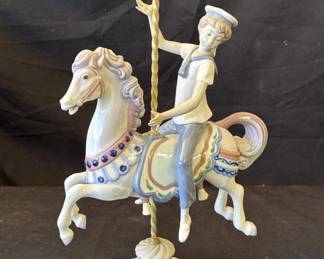 Lot # : 100z - Lladro boy on carousel porcelain figurine
