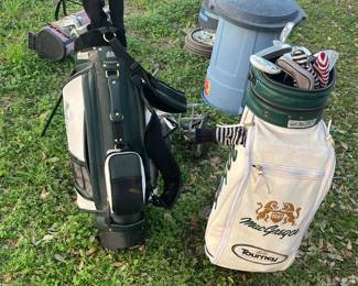 TWO GOLF BAGS & CLUBS