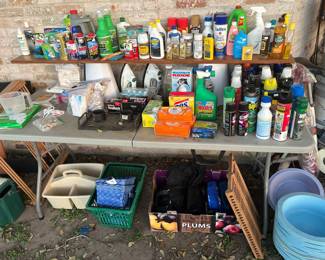 TABLE FULL OF CLEANING SUPPLIES