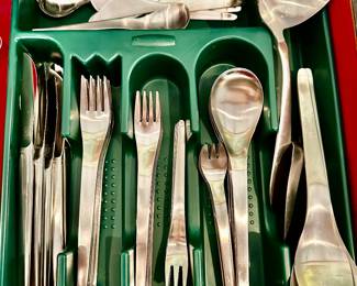 A mid century set of stainless flatware by C. Hugo Pott, Germany. Place setting pieces include four sizes of forks, three sizes of spoons, knives, and spreaders…plus four serving pieces.
