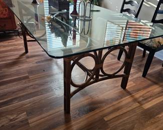 The glass top on the dining room table measures 76 in long by 42 in wide and 29 in tall