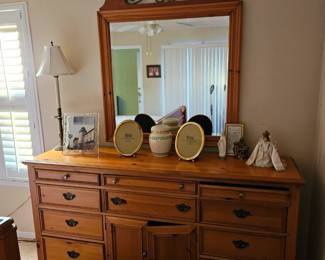 The long dresser measures 54 in long by 17 in deep and 35 and 1/2 in tall, the mirror is 17 in by 32 and 1/2 in