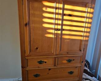 This tall cabinet measures 42 and 1/2 in by 21 in deep and 67 in tall