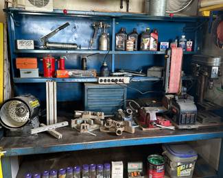 This massive garage contains multiple solid, steel cabinets and two benches! This is the largest and it is filled with all kinds of great usable items!