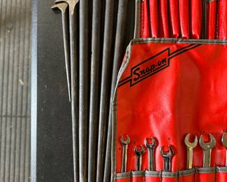 Dead side of the picture is a set of six Snap-On “Lady Foot” pry bars. These are specialized, hand tools you’ve supplying and levering.