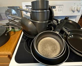 The stove, which is not for sale, is home to Oliver cookware that come in sets!