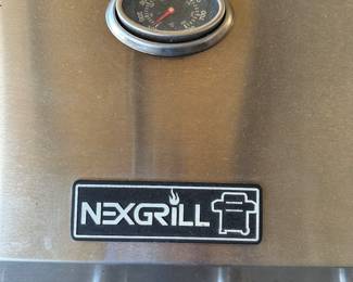 This is a fantastic and clean Nexgrill barbecue grill! A four flame grill with a burner on the side to the right! Comes complete with tank and cover. Also some utensils.