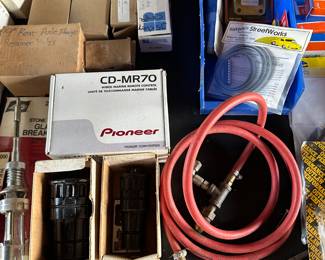 Boxes at the bottom, our tail pipe expanders, at the center in the pioneer box is a brand new marine, remote control