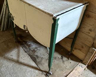 This is a nice antique metal double basin with lid!