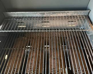 This is a fantastic and clean Nexgrill barbecue grill! A four flame grill with a burner on the side to the right! Comes complete with tank and cover. Also some utensils.