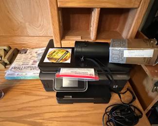 Here’s I like new printer with driver disk, cords, and paper