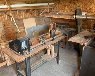 This is the very back room and it is a wood shop! Write at the center of the picture you’ll see a spindle lathe