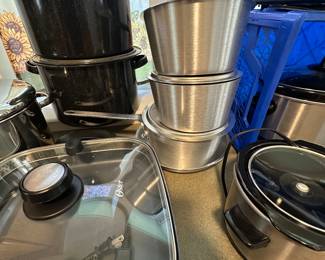 Sent her the picture has a high-end set of brushed aluminum sauce pans with lids! And no home will be complete without a giant oval crockpot!