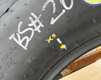 This is a very interesting piece. This is a tire from race car driver Joey Logano car number 20. It’s from the Budweiser shootout Daytona, Florida, February 6, 2010. What you see here in this picture is the signatures by the driver!