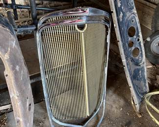 And sitting right next to the Chevy grill shells is a 1930 Chevy grill with trim!
