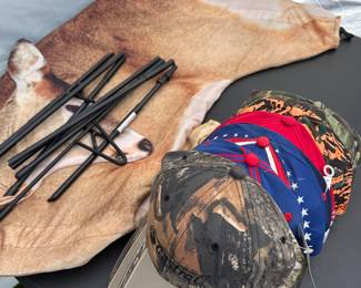 A nice dear decoy. And that pile of caps there is absolutely brand new. They all have their original tag still on them mostly camouflage but the red and blue ones are NASCAR and are numbered with drivers.