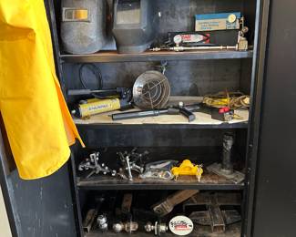 This entire steel black cabinet sits next to the arc welder. Why you might ask because it’s filled with arc welder, accessories, and more.!