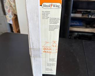 This is pretty self-explanatory. It is a royal wing purple Martin barn birdhouse. It says a design to hold up to 16 purple Martin families. Absolutely mint perfect in the unopened box.