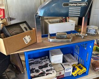 There are many small accessories for cars and motorcycles. Many of the parts are in original Harley Davidson boxes.