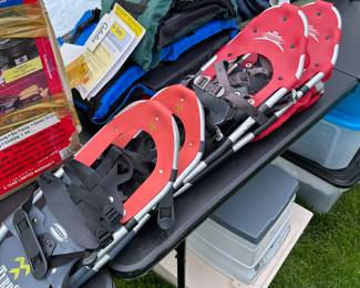 We’re now out in the tent where we have camping, hunting, and fishing items! This picture shows some absolutely mint like new snow shoes. sleeping bags, and at the top center are two brand new Cabela life preservatives!