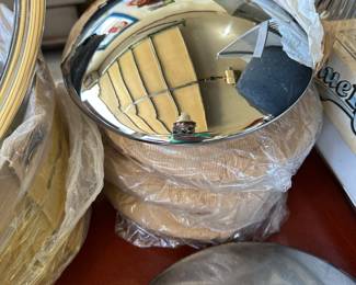 The focus of this picture are for vintage baby half Moon hubcaps! Absolutely mint perfect condition. The one at the top I opened for this photograph.