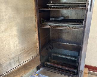 This is a massive professional grade smoker! Comes with tank and the base that is on wheels! Take a look a good look!