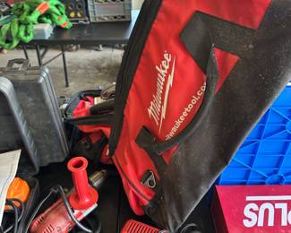 These next few shots are of a banquet table filled with Milwaukee tools and many other brands. More Milwaukee tools and an empty Milwaukee tool bag.