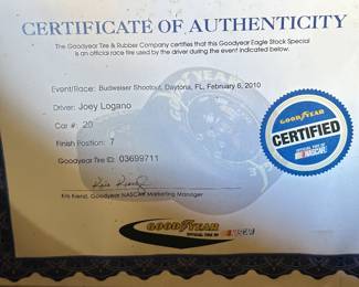This is a very interesting piece. This is a tire from race car driver Joey Logano car number 20. It’s from the Budweiser shootout Daytona, Florida, February 6, 2010. What you see here in this picture is the certificate of authenticity!