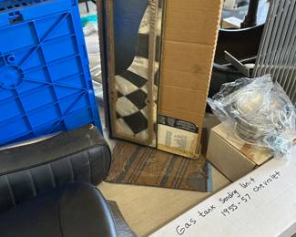 Top center are boxes of brand new gaskets bottom, right as a gas tank unit for 1955 1957 Chevy. And more.