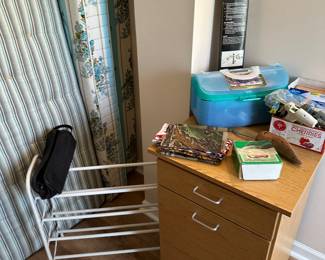 There’s one of the several shoe racks we have. On top of that three drawer cabinet are a few sewing notions.