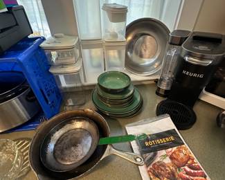 A nice piece of cast-iron and a terrific Keurig coffee machine! It’s newer and looks as it fits had very little use!