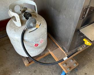 This is a massive professional grade smoker! Comes with tank and the base that is on wheels! Take a look a good look!