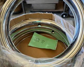This image shows 15 inch stainless steel chrome plated beauty trim rings for vehicle wheels. They are mint and were unopened in their original package. I pulled this one out for the photograph.
