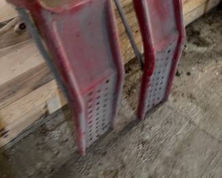 A pair of nice red metal car ramps