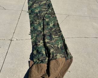 This is a large rectangle hunting blind with poles