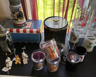 At the center of a mid-century, modern ice bucket, some collectible mugs and I love the Ulysses S Grant, Stein at the top of the picture it has it original box also