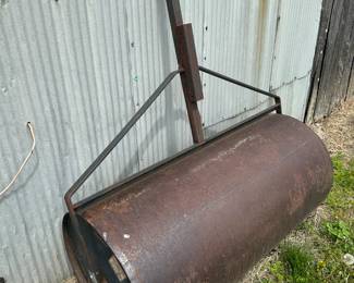 A very nice vintage 4 foot pull behind metal lawn roller, just add water and go!